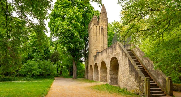 Photo of Park behind Speyer Cathedral with old city fortification and tower, Speyer, Germany.
