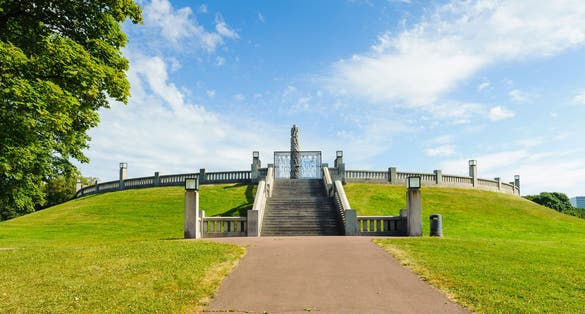 Photo of panoramic view of the central obelisk made of the sculptures of Frogner Park, Oslo, Norway.