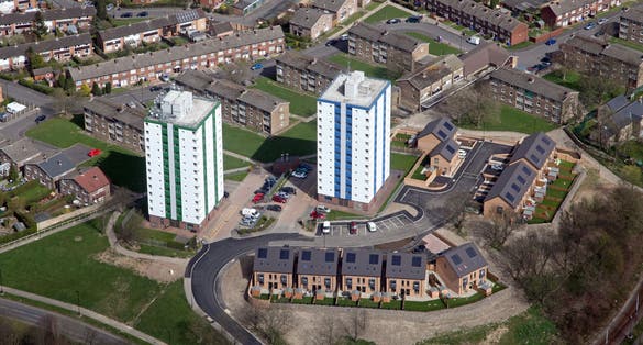 aerial view of two blocks of flats in Sheffield, and new housing