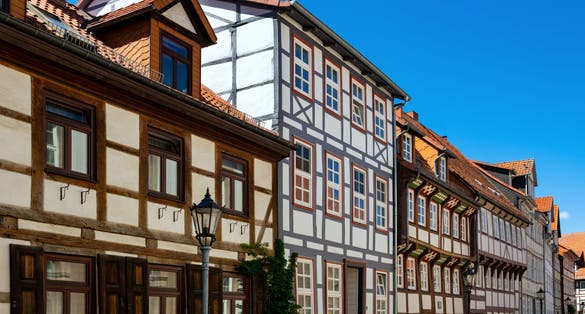 Photo of Romantic Neighbourhood with renovated facades of Half-timbered houses in the old town of Göttingen Niedersachsen Germany on a sunny spring day.