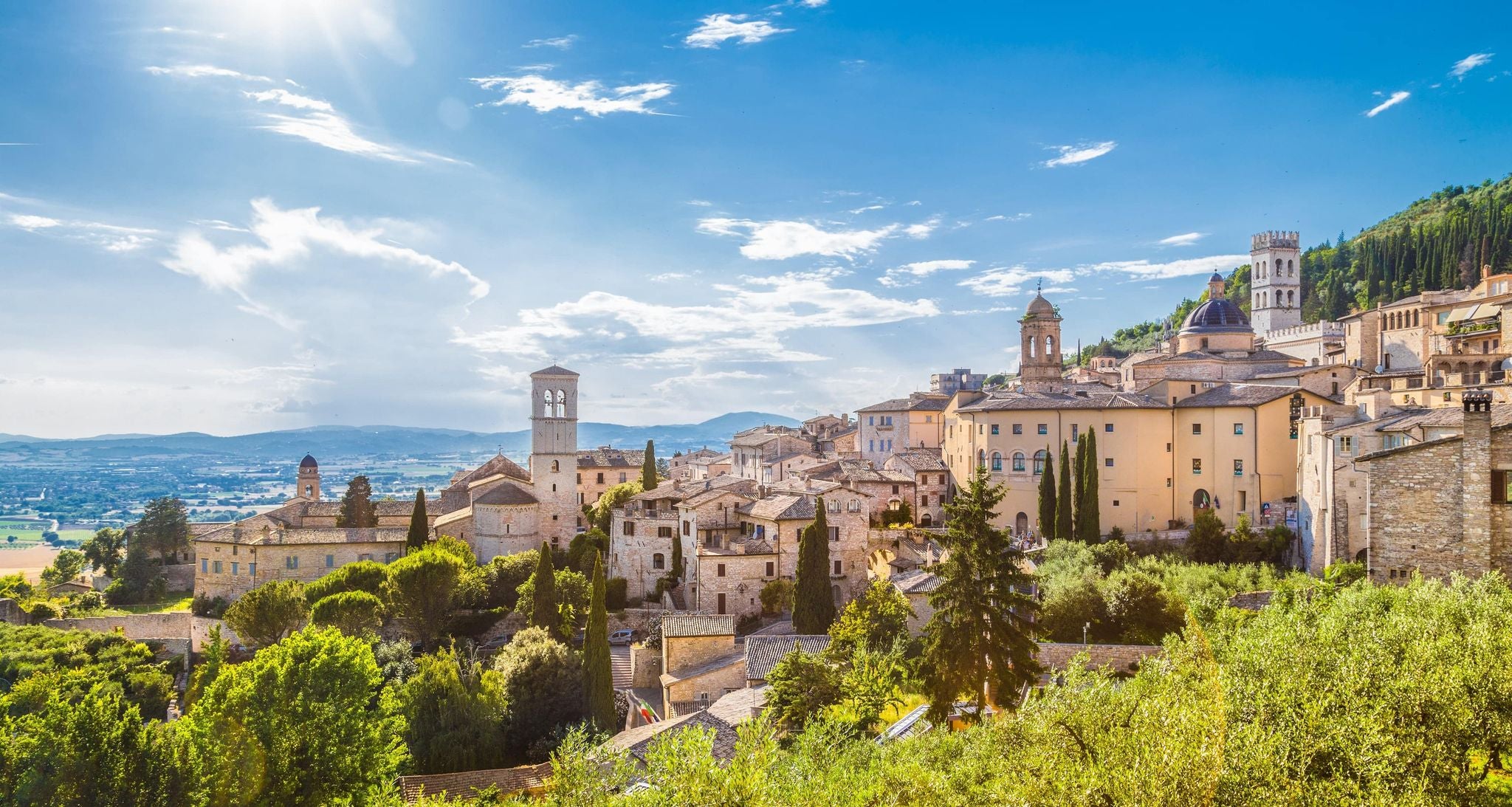 Sunny countryside views of Umbria during the summer travel season in Italy..jpg