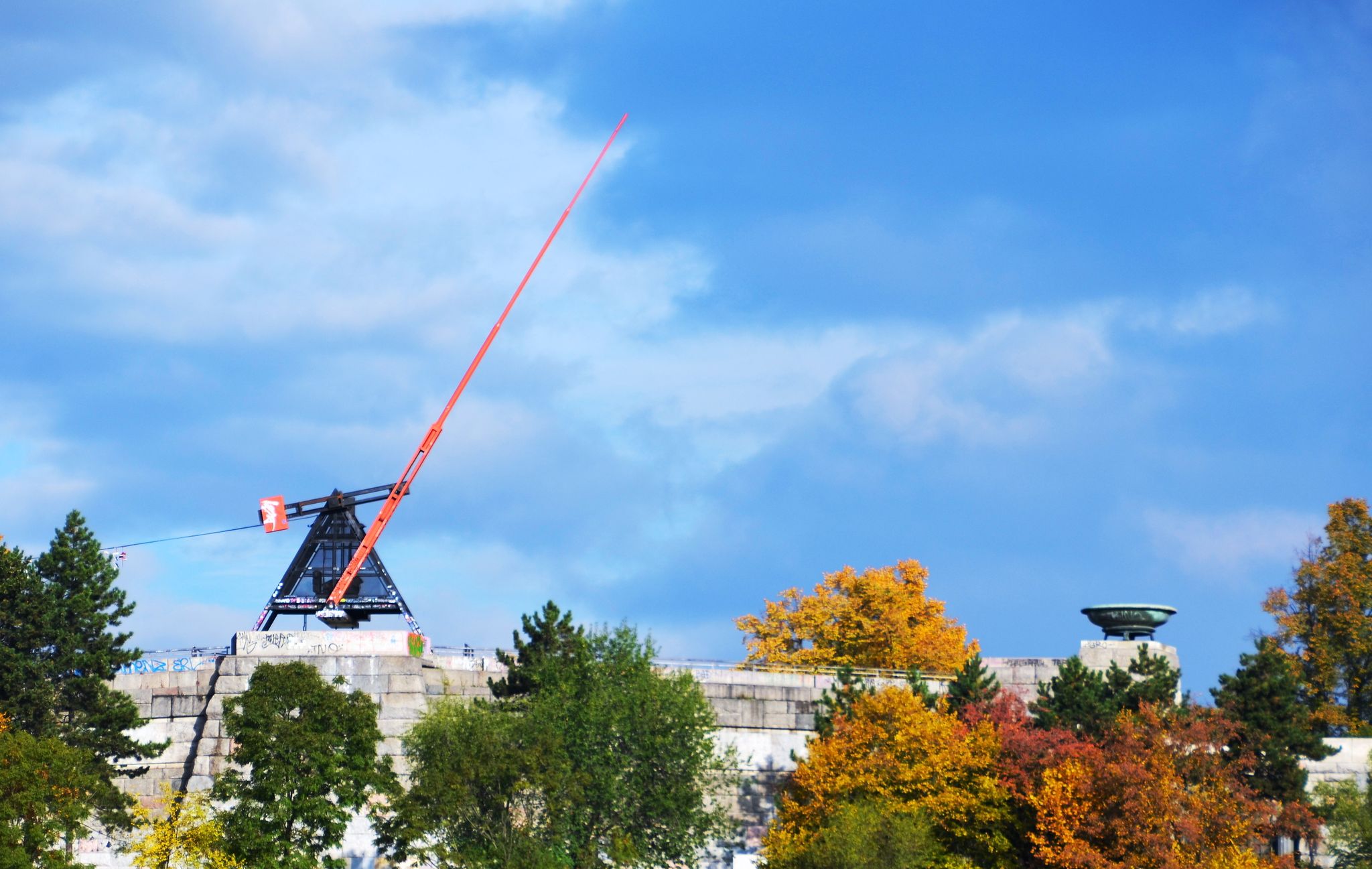 Photo of the Prague Metronome a giant, functional metronome in Letna Park, overlooking the Vltava River and the city center of Prague, Czechia.