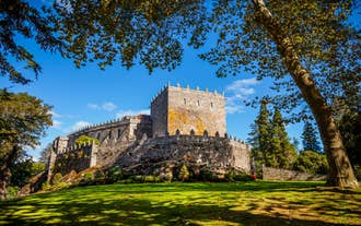 Photo of aerial view of an empty beach in Portonovo in the Ria de Pontevedra, Spain.