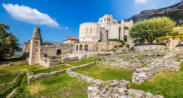 Photo of Kruje Castle and its fortress with the walls and mountains in the background, Albania.