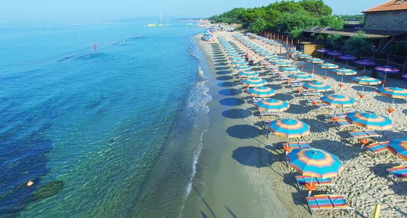 Overhead view of Beach Umbrellas along the coast.