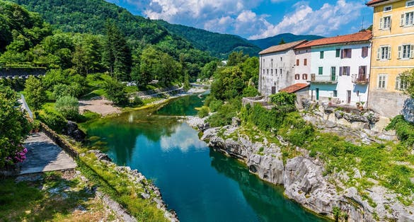 Kanal or Kanal ob Soč relaxing and small Slovenian village with a springboard to dive from the bridge. Small beach on the river with a view of the village from above. Slovenian landscapes. Nova Gorica