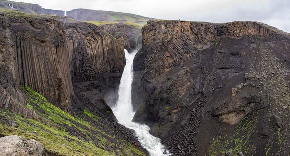 photo of Litlanesfoss waterfall in Iceland with its basaltic geologic landscape in cloudy weather, Iceland