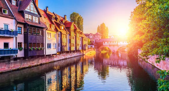 Photo of Scenic summer sunset view of the bridge over Pegnitz River in the Old Town architecture of Nurnberg,.