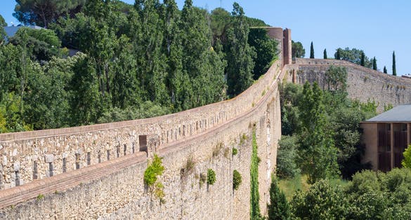 Photo of City Walls Walkway in Girona, Spain. City wall fortification, 9th-century city walls.