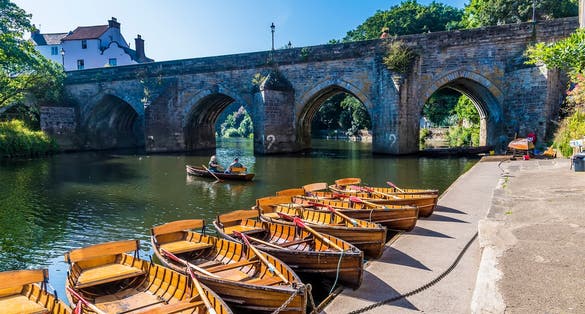 photo of view of A view along the River Wear towards the Elvet Bridge in Durham, UK in summertime.