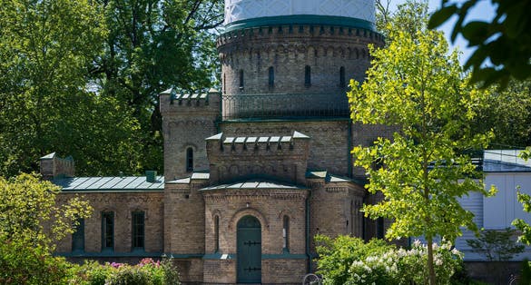 photo of the old observatory in the park Stadsparken in Lund Sweden during summer.