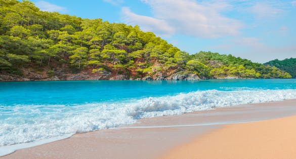 Photo of panoramic view of amazing Oludeniz beach And blue lagoon, Oludeniz beach is from the best beaches in Fethiye, Turkey.