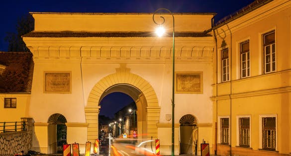 Photo of Schei Gate in Brasov. Brasov, Brasov County, Romania at night .