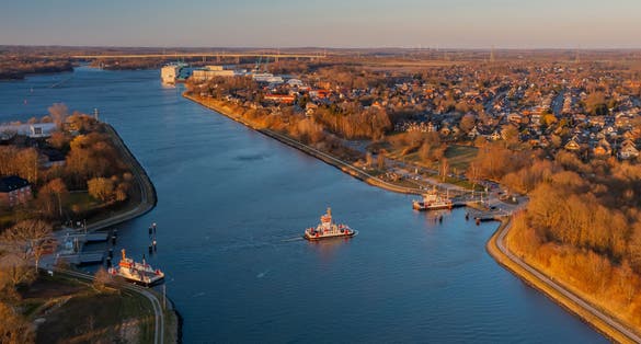 Panorama aerial view of Kiel Canal and canal ferry near Rendsburg, Schacht-Audorf ferry terminal, Schleswig-Holstein, Germany.