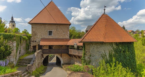 Photo of the entrance of the Old Castle and town Ozalj, built on a cliff over the Kupa river in 13th century, Croatia.