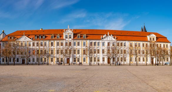 Panoramic view over major square with fountains in Magdeburg by Cathedral and Government Office, at sunny day and blue sky