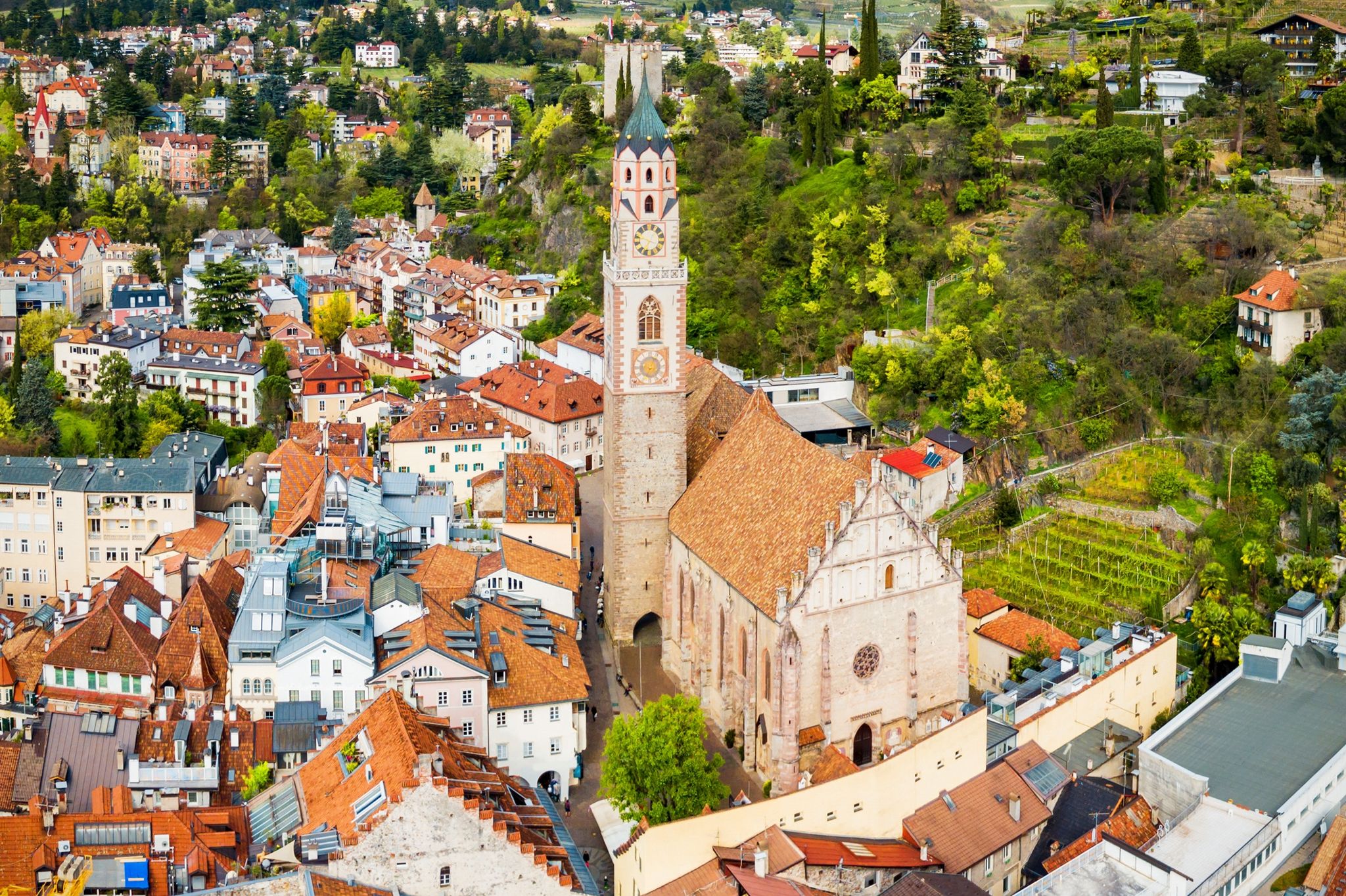 St. Nicholas Church aerial panoramic view in Merano. Merano or Meran is a town in South Tyrol in northern Italy.