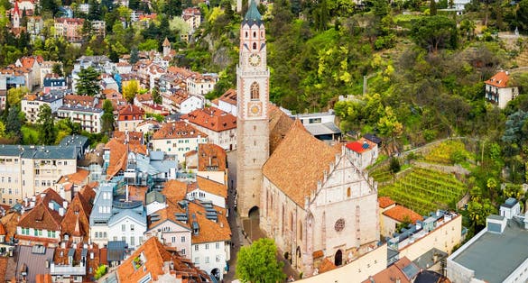 St. Nicholas Church aerial panoramic view in Merano. Merano or Meran is a town in South Tyrol in northern Italy.