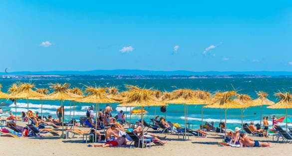 Photo of people enjoying sunny day on a beach in the Bulgarian city Burgas.