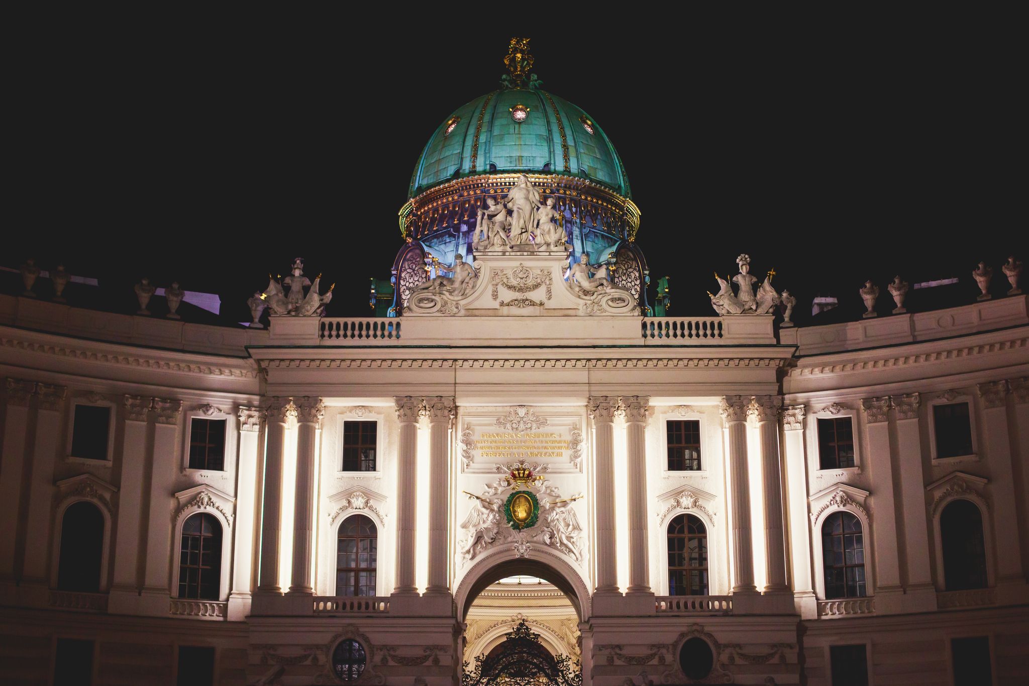 Photo of view of Hofburg imperial palace facade exterior with Heldenplatz, Vienna Old Town Historic Center, Austria.