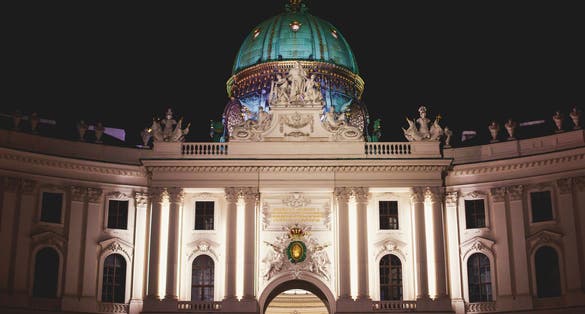 Photo of view of Hofburg imperial palace facade exterior with Heldenplatz, Vienna Old Town Historic Center, Austria.