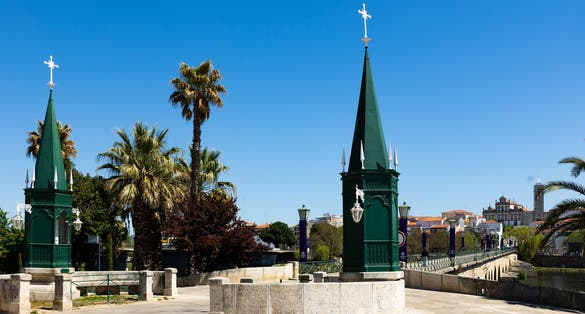 Photo of Urban landscape of city of Mirandela in the north of Portugal with the banks of the river Tua with the traditional Roman bridge.