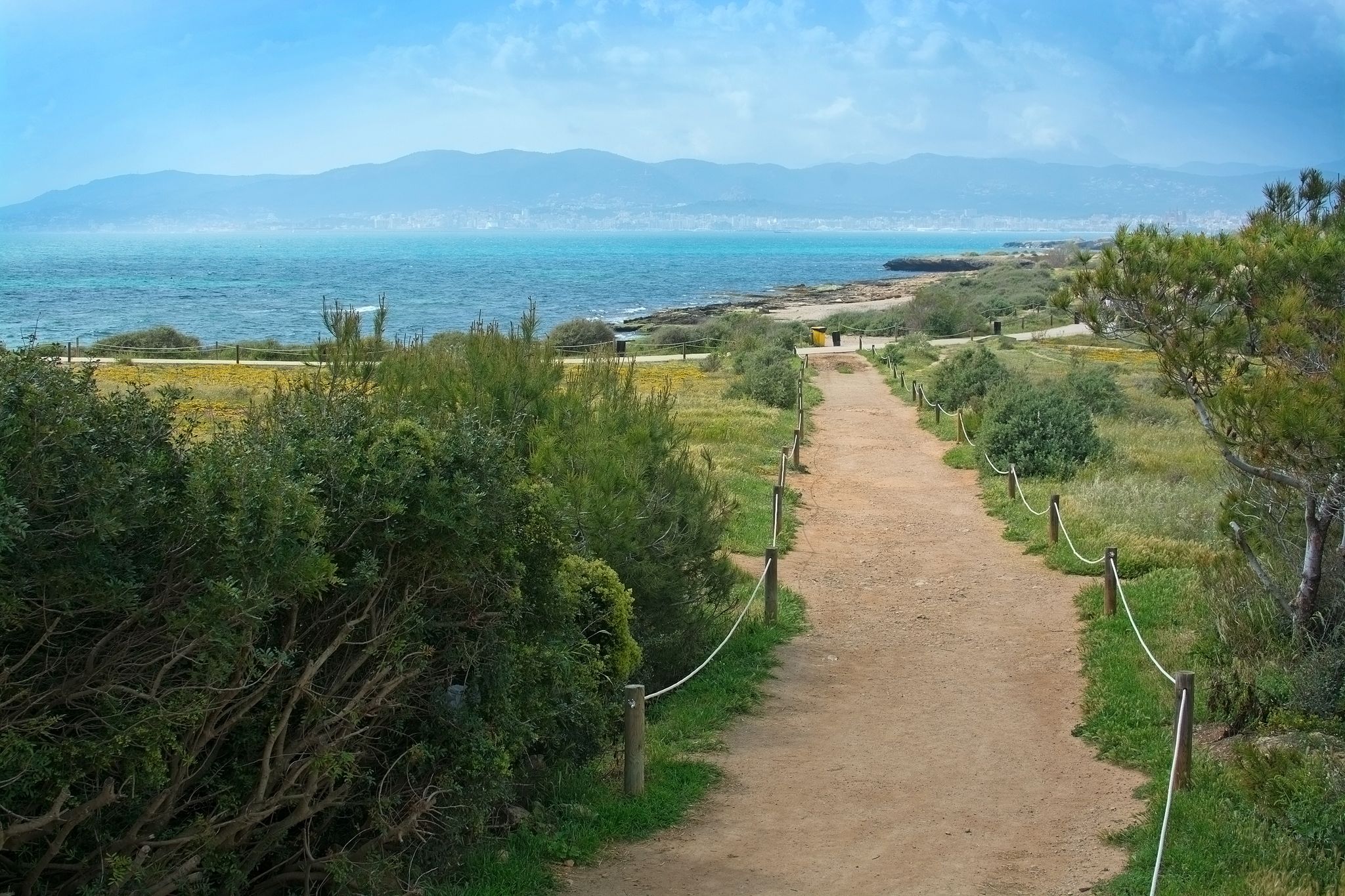 Photo of Es Carnatge path and view over Palma bay in springtime sunhaze ,Spain .