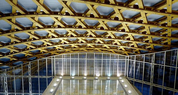 Interior view of the carpentry structure at night. 