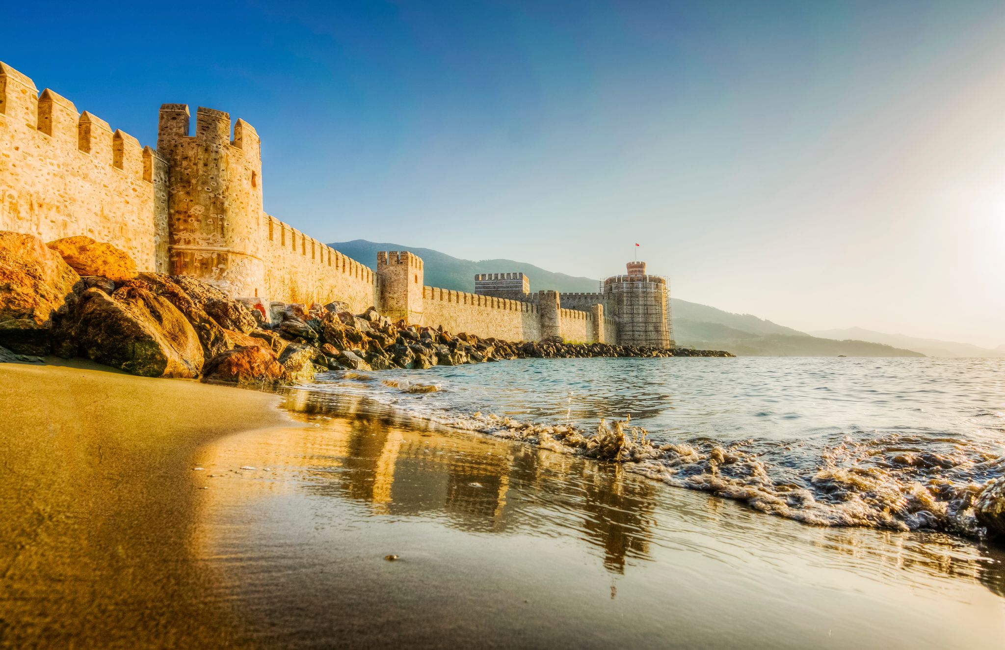 photo of a beautiful sunset on  Mamure Castle in Mersin, Turkey. 