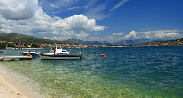 Photo of sea and blue sky with clouds (Trogir region, Croatia).