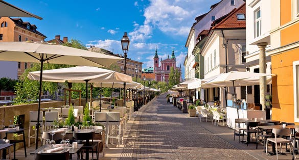 Photo of Ljubljana riverfront promenade walkway summer view, Slovenia.
