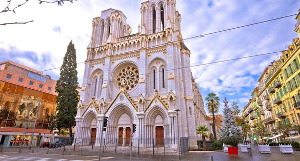 The Basilica of Notre-Dame de Nice and street of Nice view. Town in French riviera. 