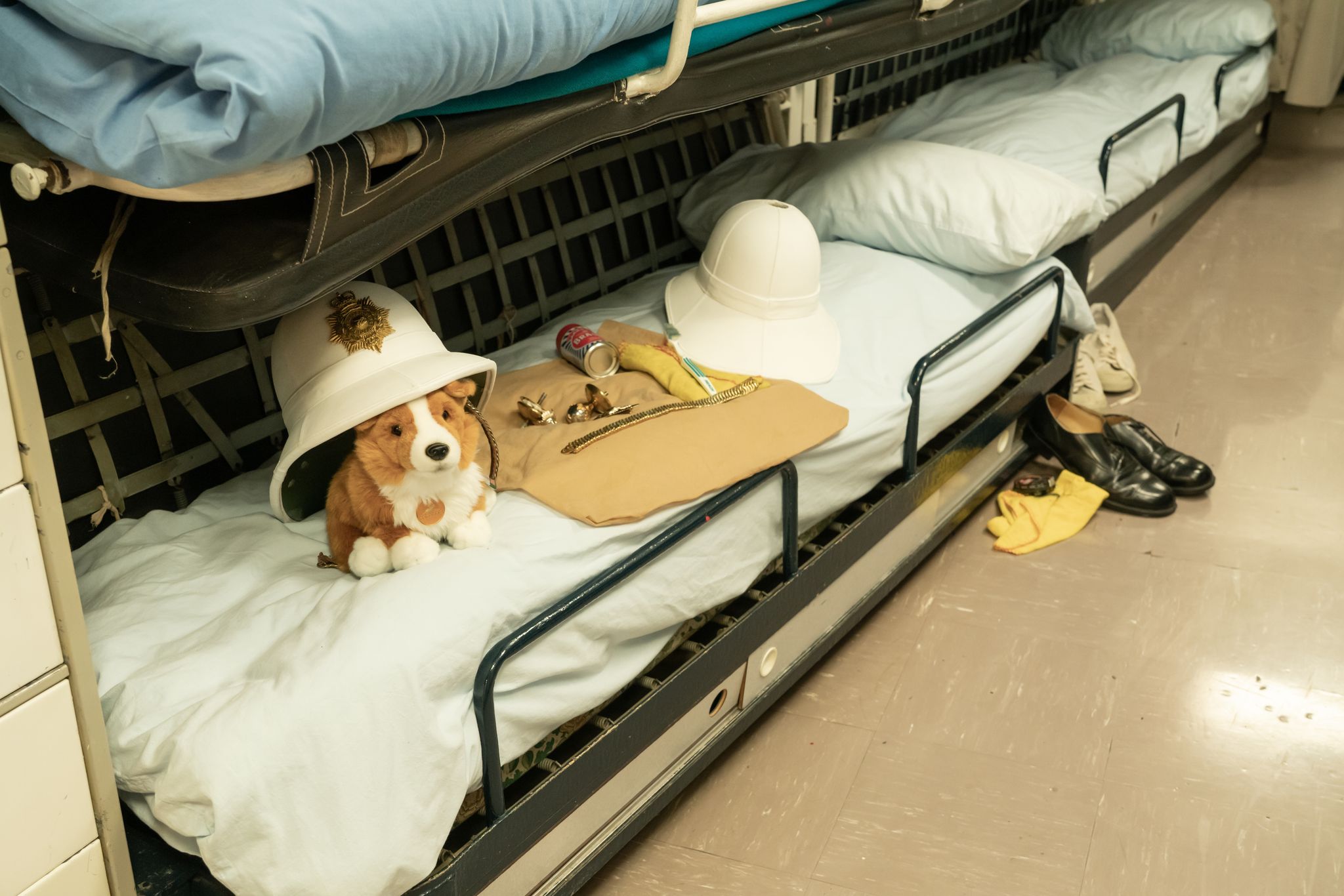 Royal Yacht Britannia docked at the Ocean Terminal. Bedrooms on board the vessel where the sailors slept. 90% focus, some noise. Rooms where the marines lived.