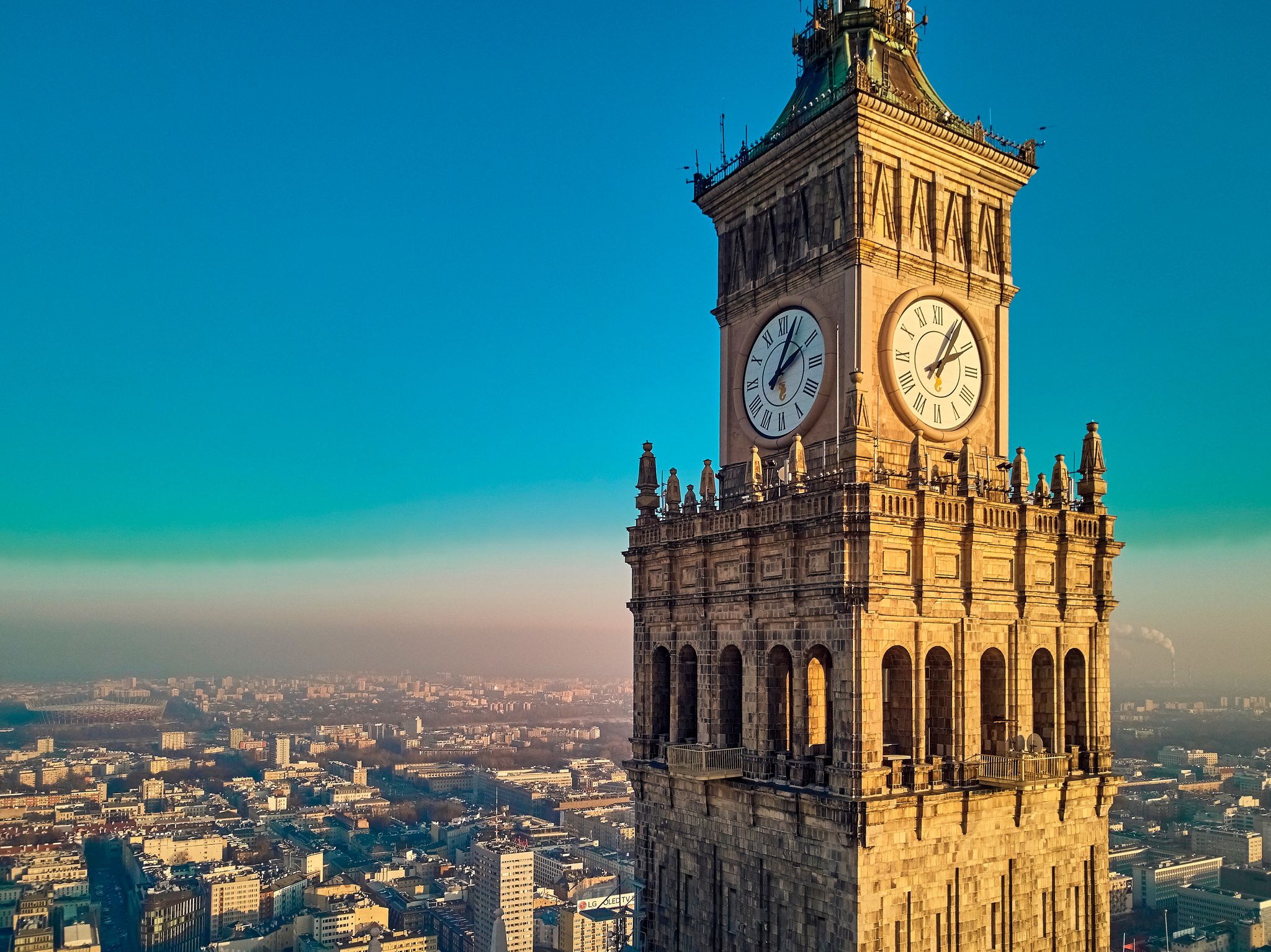 Photo of beautiful panoramic aerial drone view of the large clock of Palace of Culture and Science in Warsaw, Poland.