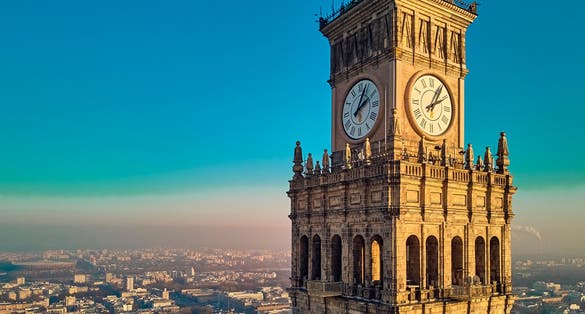 Photo of beautiful panoramic aerial drone view of the large clock of Palace of Culture and Science in Warsaw, Poland.