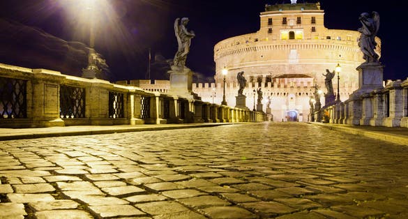 Night picture of a bridge leading to Castel Sant'Angelo.
