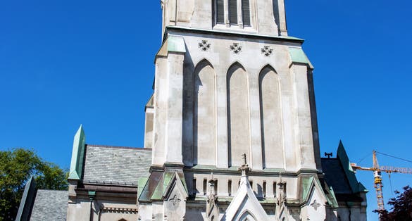 Photo of Kristiansand Cathedral on a clear day with blue sky, Norway.