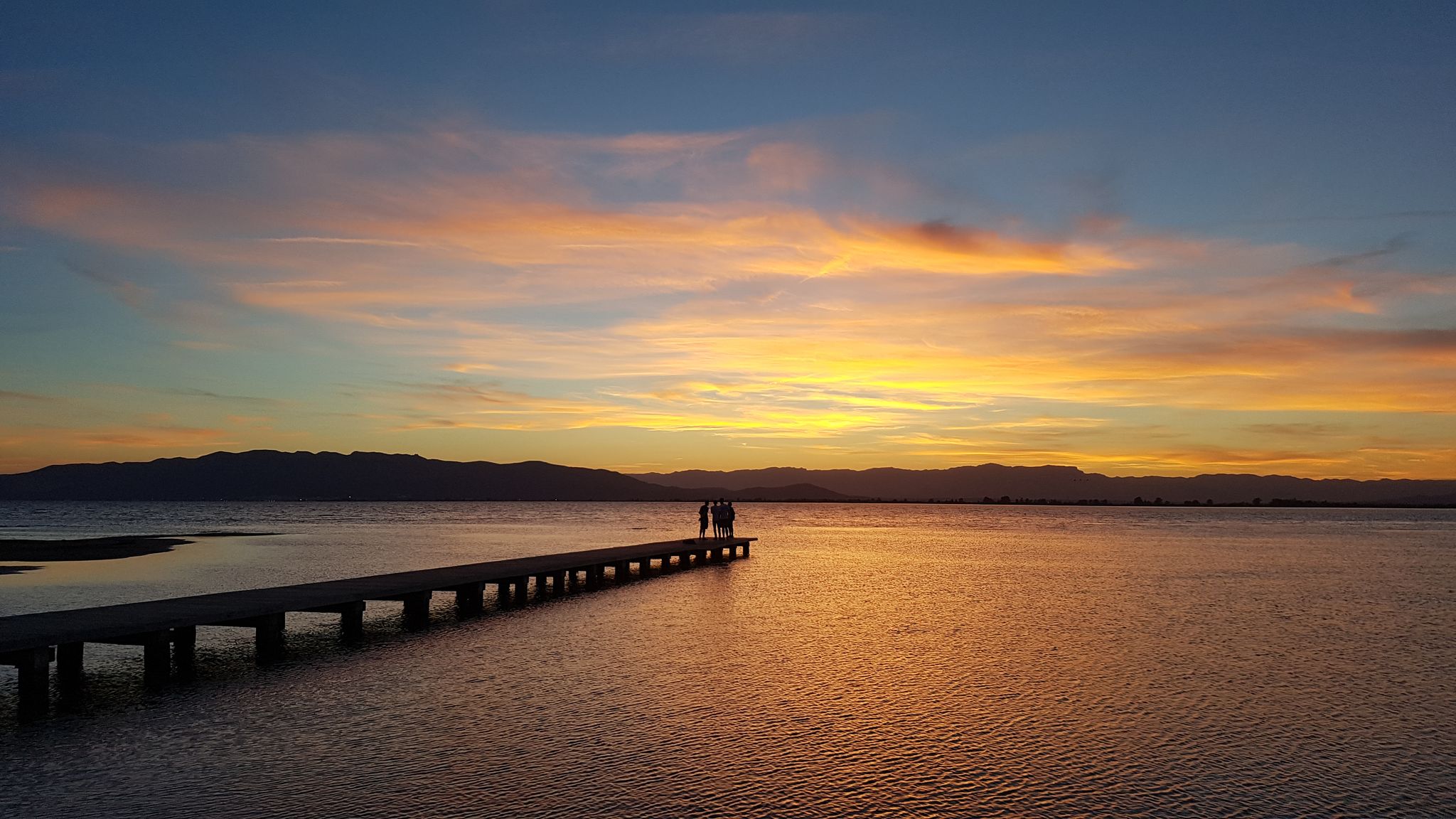 Photo of Sunset at platja Trabucador in the Ebro Delta in the south of the province Tarragona in Catalonia (North of Spain) .