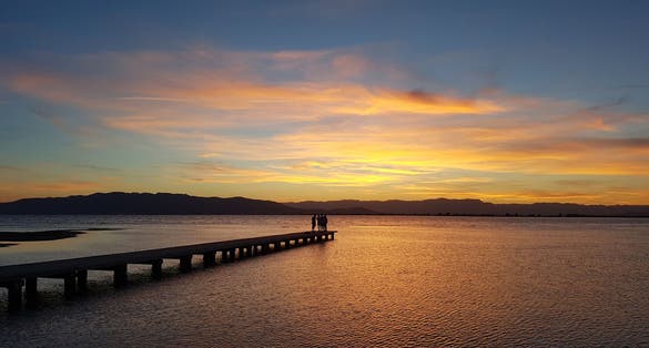 Photo of Sunset at platja Trabucador in the Ebro Delta in the south of the province Tarragona in Catalonia (North of Spain) .