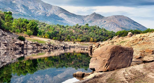 photo of view of Alberche river in Navaluenga and Sierra de Gredos. Avila. Spain.
