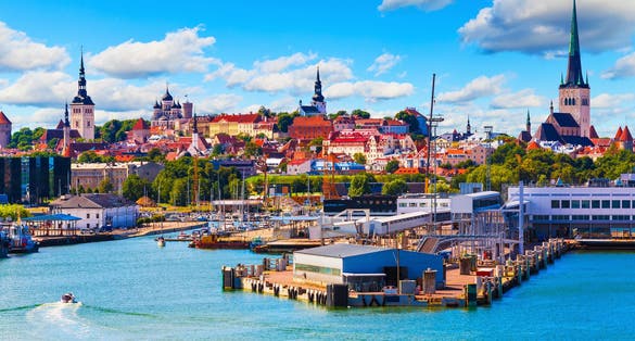 Scenic summer view of the Old Town and sea port harbor in Tallinn, Estonia.
