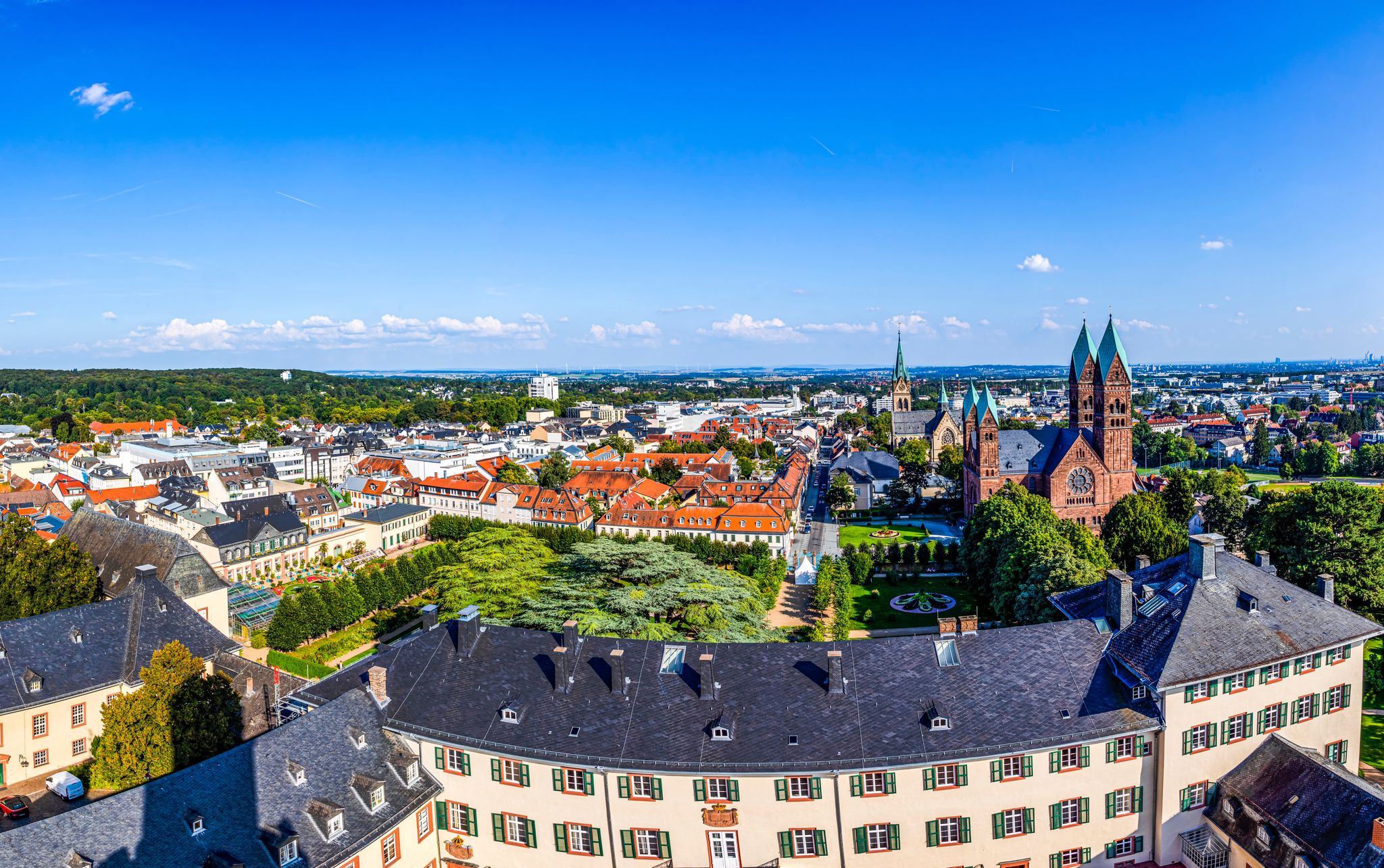 Photo of panoramic view of Bad Homburg twith Frankfurt at horizon and aerial of the castle .