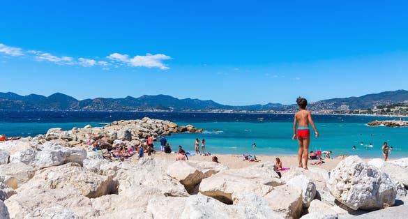 City beach of Cannes with unidentified people.