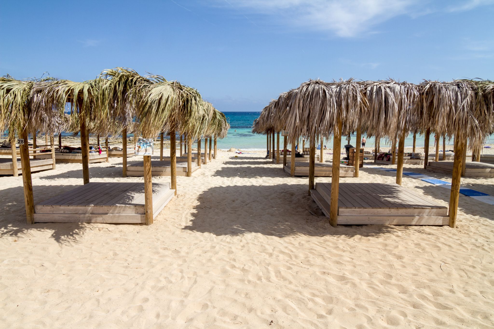 Photo of beautiful Makronissos Beach with umbrellas and sunbeds ,Cyprus.