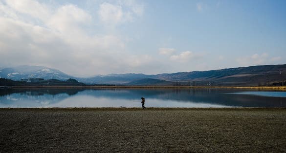 Fisherman on lake Lisi in Georgia