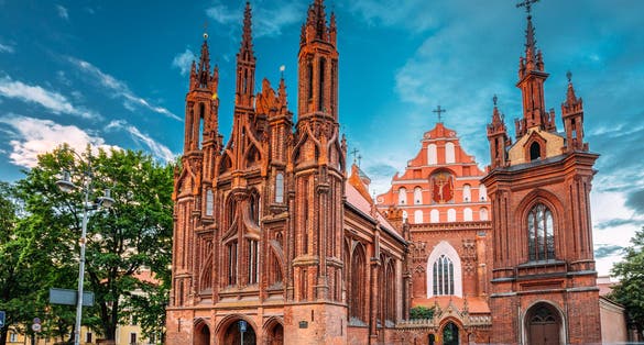 photo of vilnius, Lithuania. View of roman catholic church of st. anne and church of st. francis and st. bernard In old town In summer sunny day. 