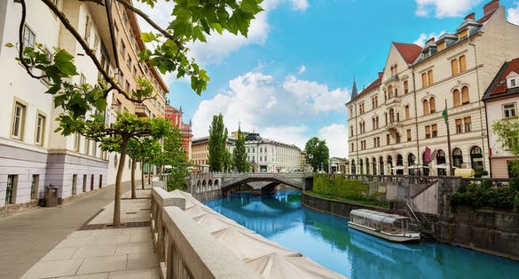 Photo of Ljubljana river embankment in downtown on central street.