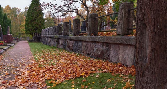 Photo of the alleys of the park in Hietaniemi cemetery, Helsinki, Finland.
