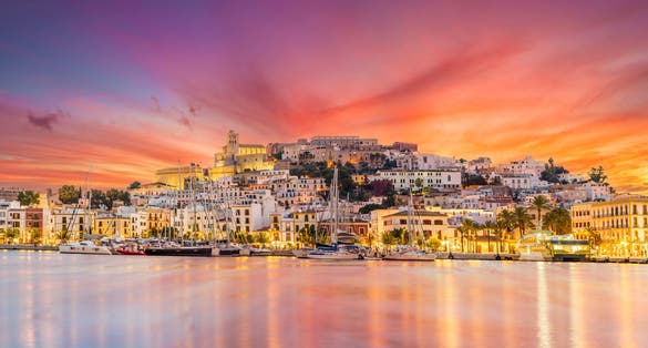 Photo of landscape with Eivissa town at twilight time, Ibiza island, Spain.