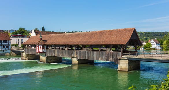photo of the covered wooden bridge over the river Reuss in Bremgarten, Switzerland.